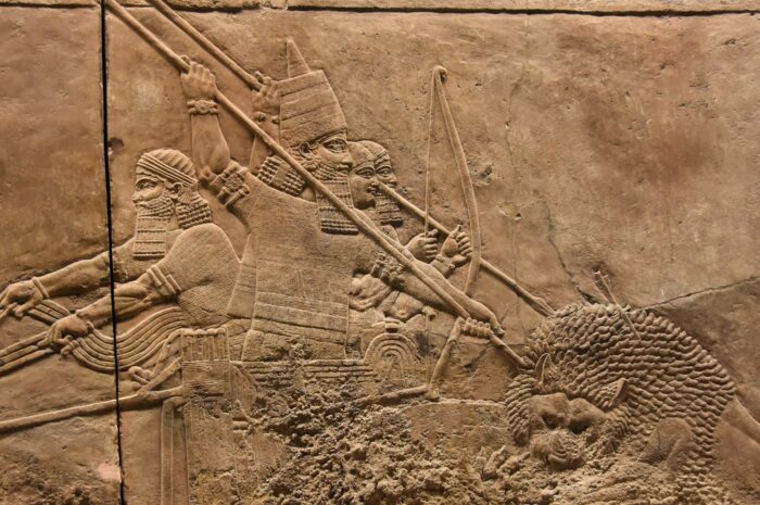 Ashurbanipal hunting and spearing lion down